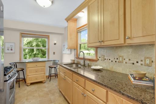 Great kitchen layout with convenient table with additional storage