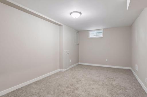lower level family room features impressively high ceilings
