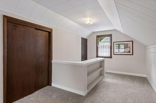 built-in shelving on the upper floor landing