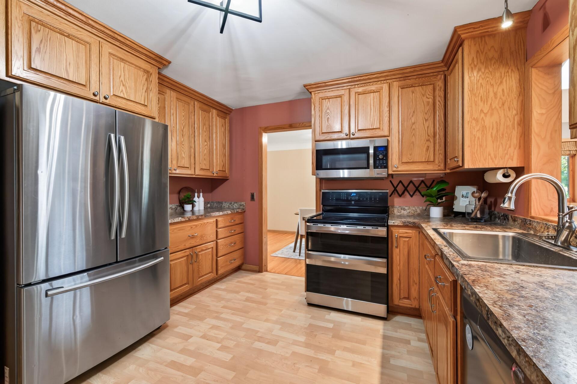 Stainless steel appliances and abundant cabinetry provide everything you need for everyday living.