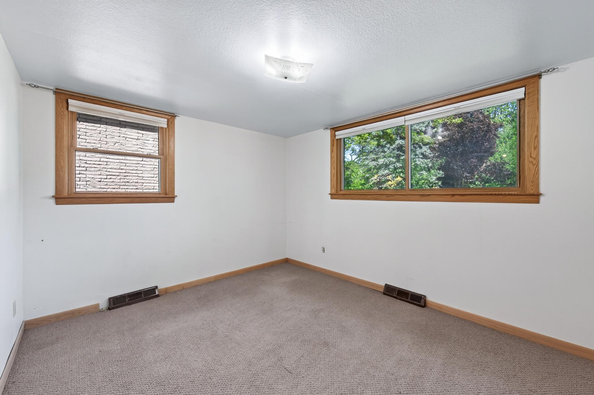 Bright, neutral finishes make this bedroom move-in ready.