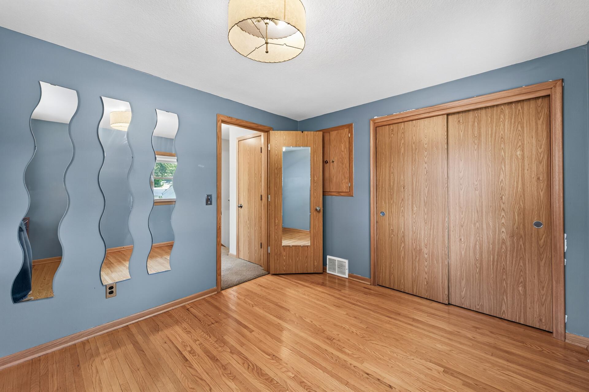 Another spacious bedroom offers flexibility for family, guests, or a home office.