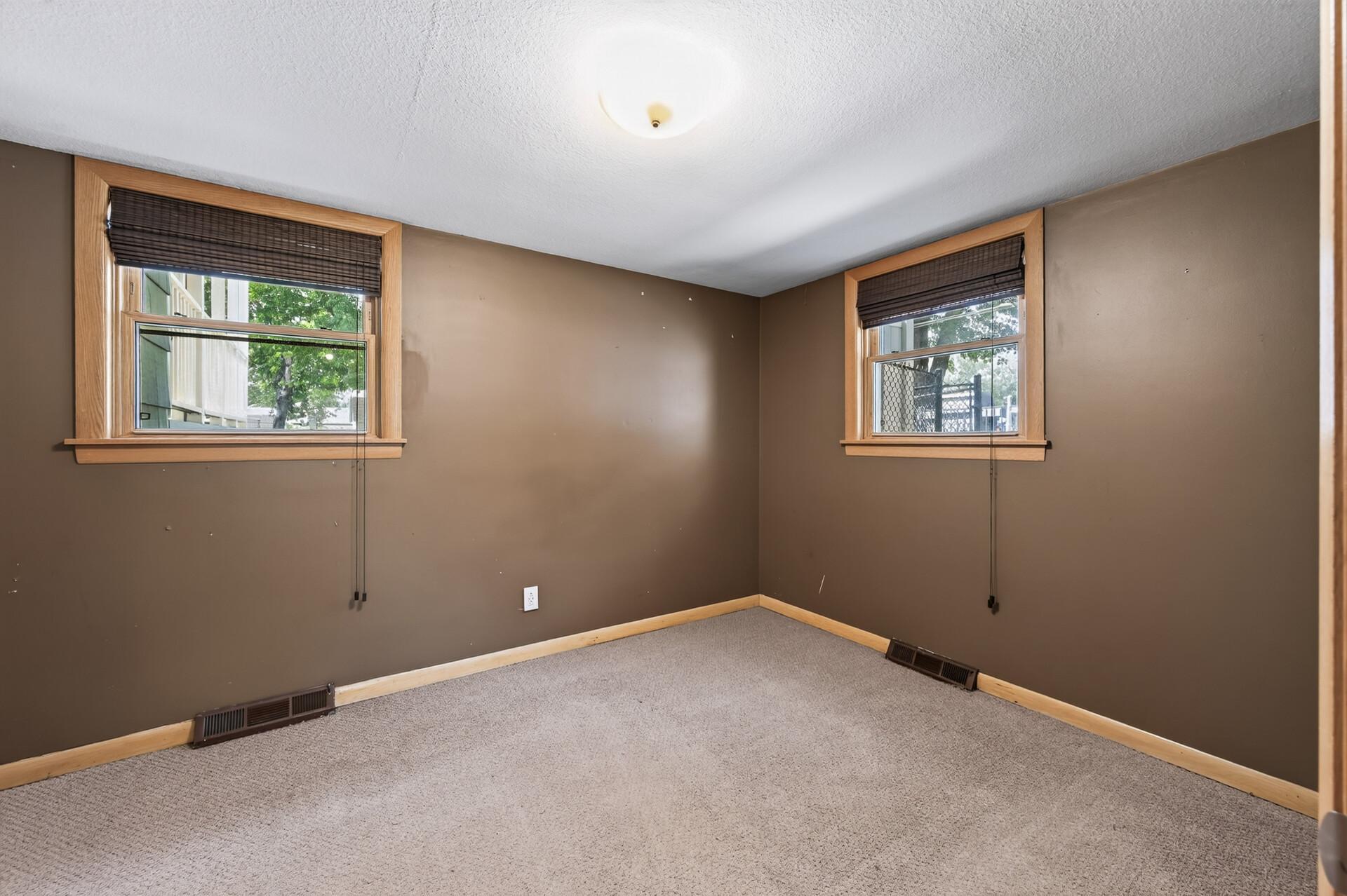 This versatile bedroom is filled with natural light and plenty of closet space.