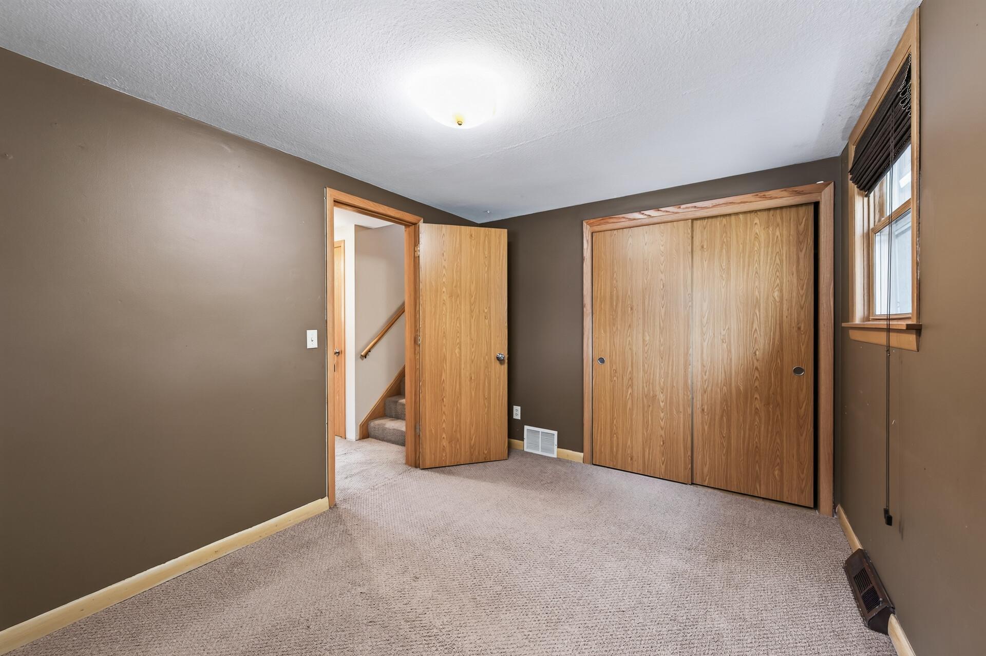 Enjoy a 5th lower level bedroom with a large closet space.