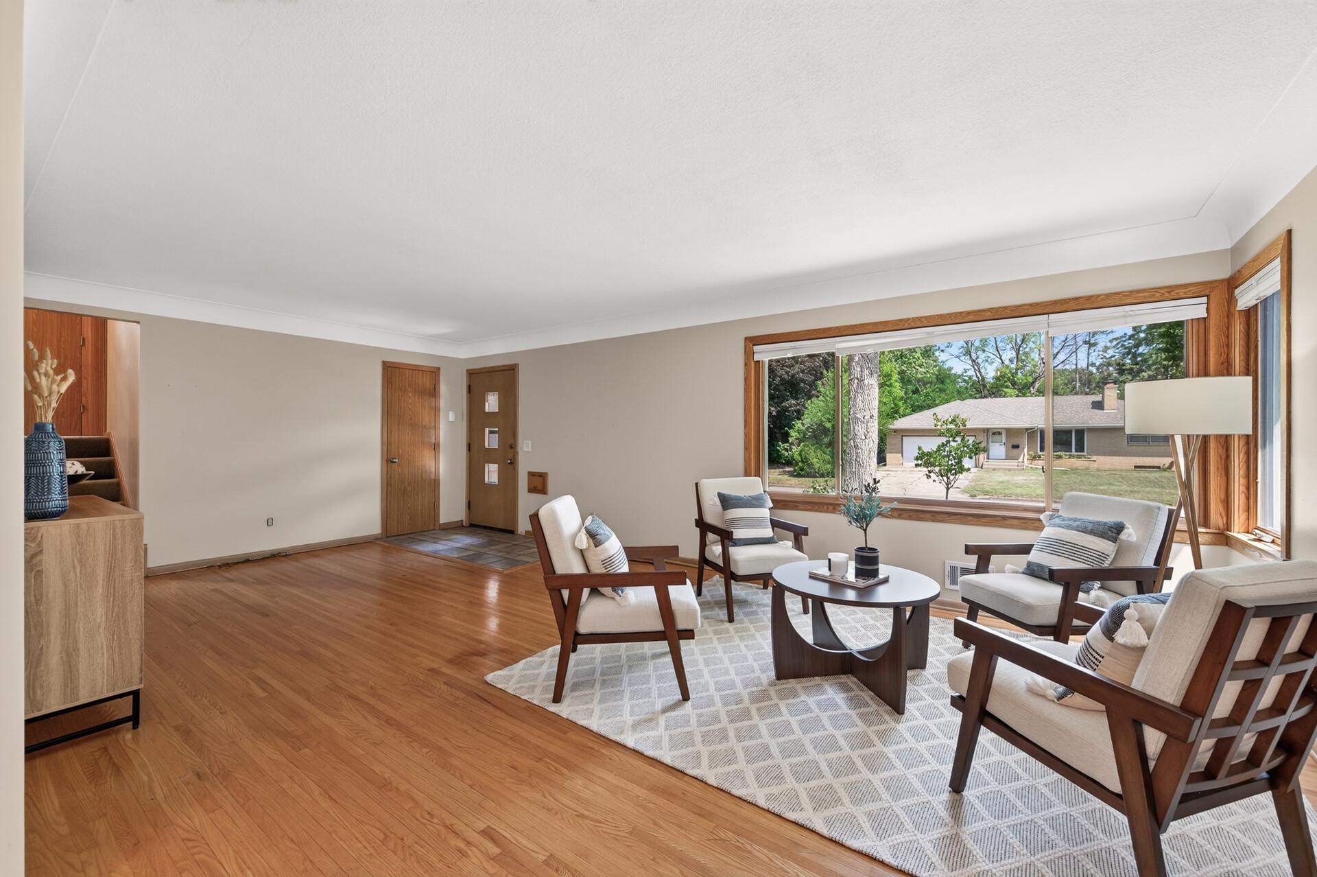Large picture windows bring the outdoors in and make the main living space feel even more expansive.