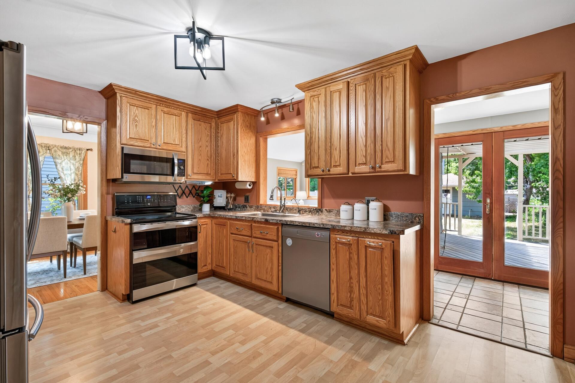 Warm wood cabinetry and plenty of prep space make this kitchen both functional and inviting.