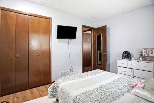 Alternate view of the secondary bedroom showing closet and flexible space for bedroom or home office use.