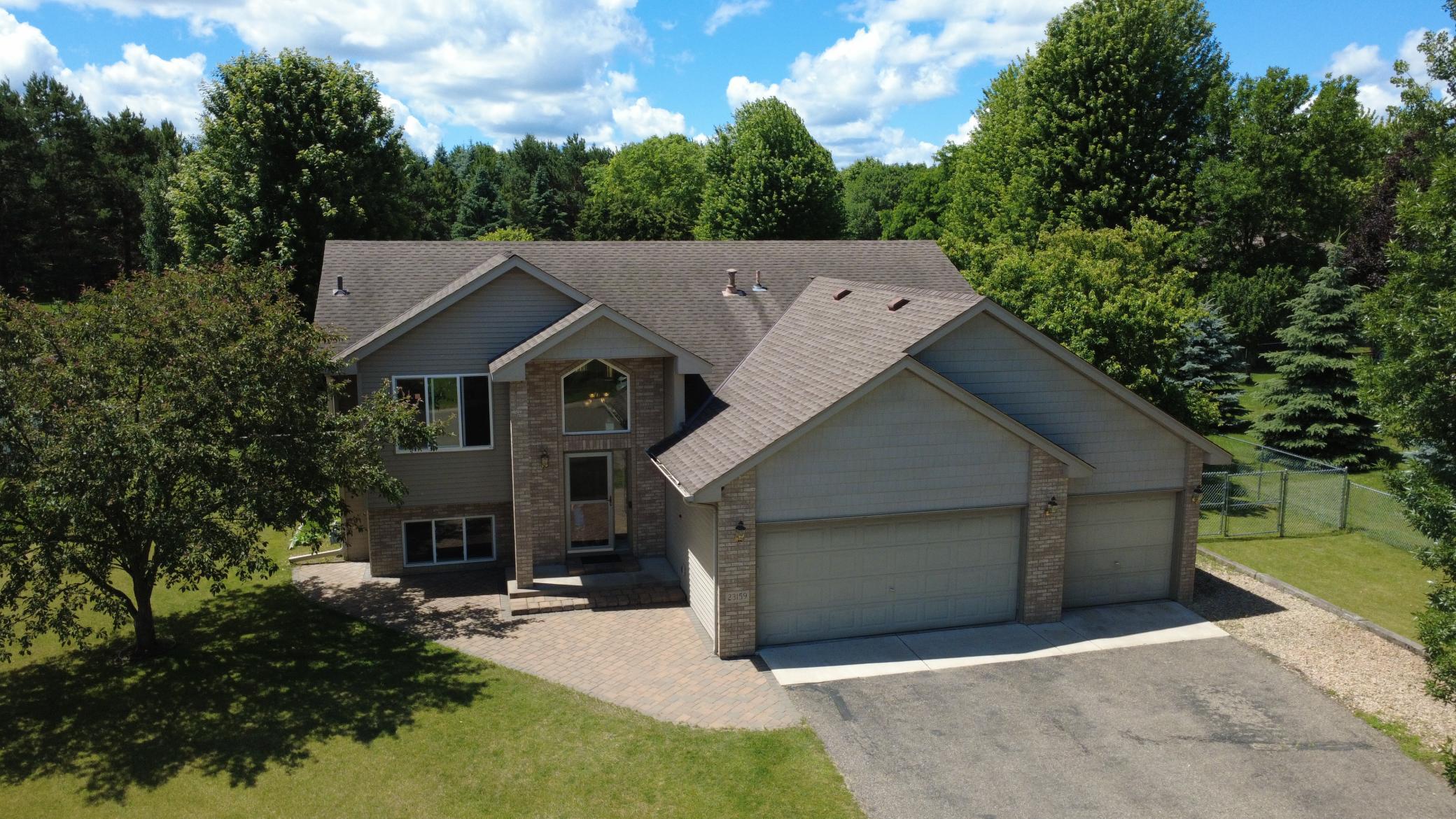 Primary front photo, well kept home with a HUGE fenced flat backyard, almost the size of a football field.