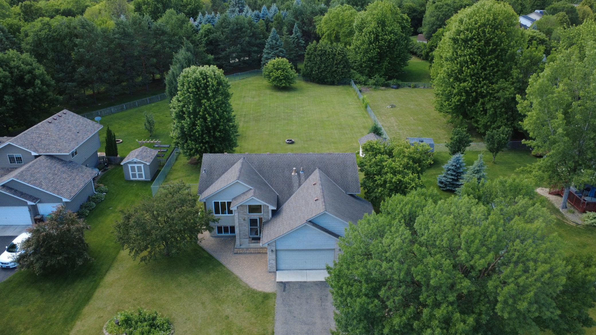 Aerial photo of home noting large depp back yard and nice tree coverage.