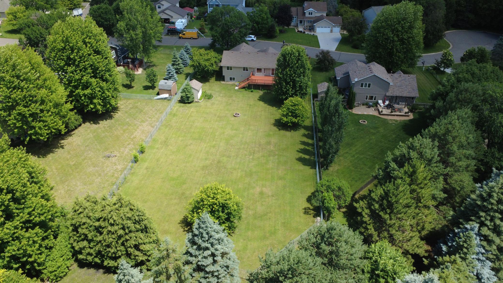 Huge, flat, fenced backyard waiting for playtime, entertaining and enjoying the outdoors. Large deck off of kitchen, amazing back yard!