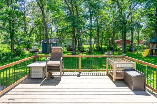 The expansive deck offers the ideal space for dining, gathering, and making memories with family and friends.