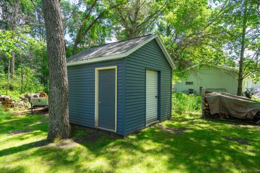 The new storage shed provides plenty of space for lawn equipment and outdoor toys.