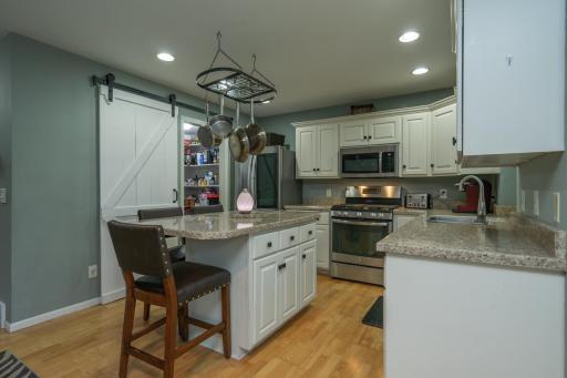 Timeless finishes, generous storage, and plenty of workspace make this kitchen as functional as it is beautiful.