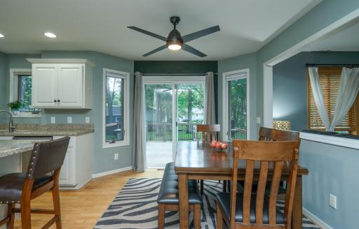 Enjoy meals with a view in this bright dining area overlooking the backyard.