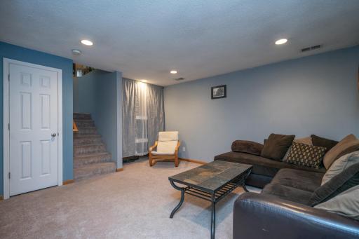 Cozy up with family or host guests in this inviting lower-level retreat.