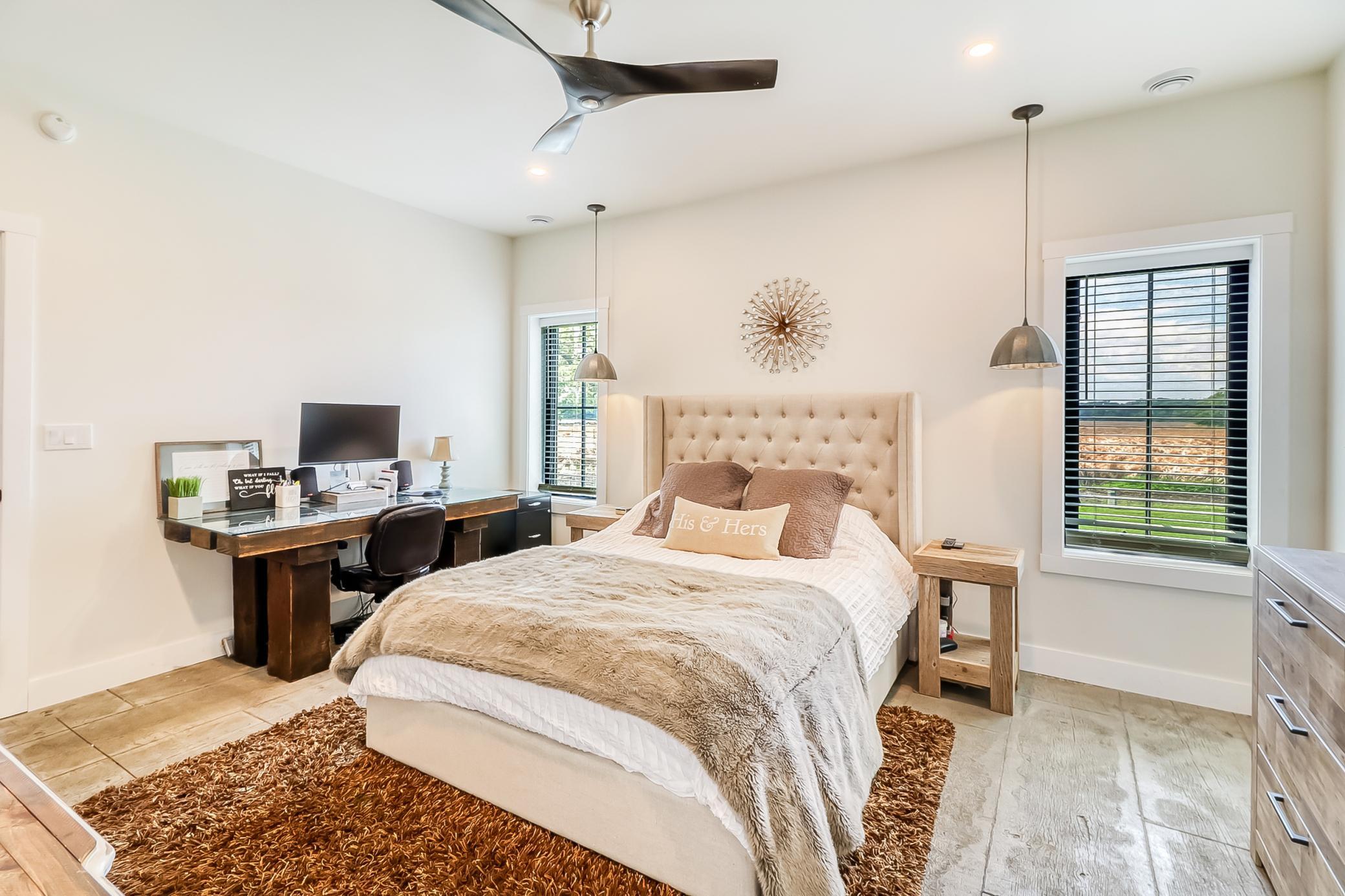 Master Bedroom with ceiling fan for added comfort.