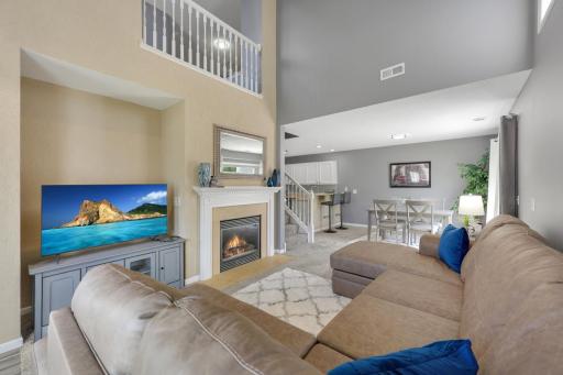 Grand 2 story Living Room with Vaulted Ceiling and Gas Fireplace