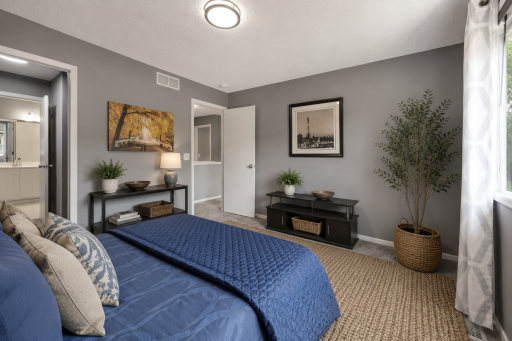 Walk through to large closets and the full bath - virtually staged