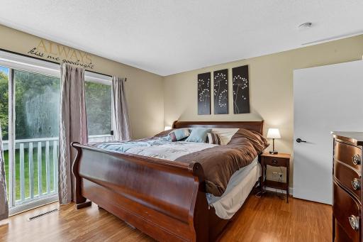 Main floor primary bedroom with sliding doors.