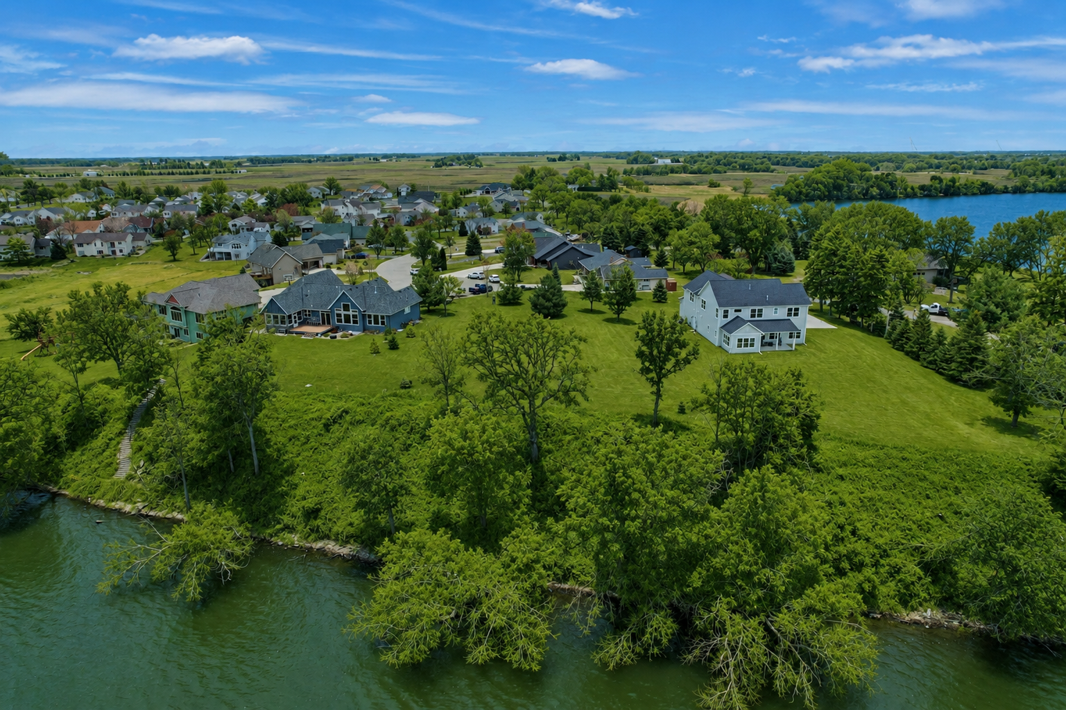 Create the home you've always envisioned on this exceptional waterfront lot spanning nearly one acre.