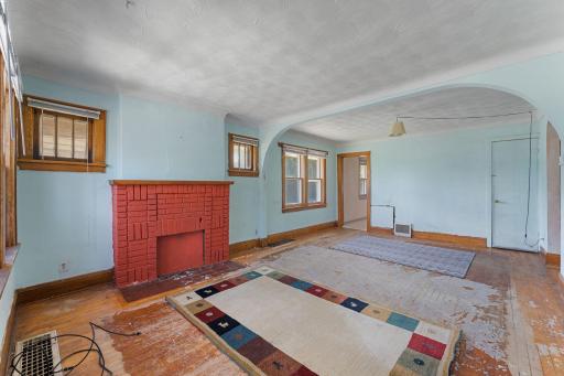 Open and spacious floorplan with hardwood flooring and cozy fireplace. Could separate and have a designated dining area too