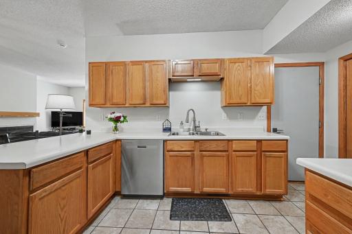 Bright kitchen featuring ample cabinet storage, generous counter space, and stainless steel appliances..jpg