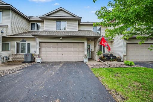 Front exterior view of 1106 Crystal Place W with driveway parking, attached garage, and convenient Chaska location..jpg