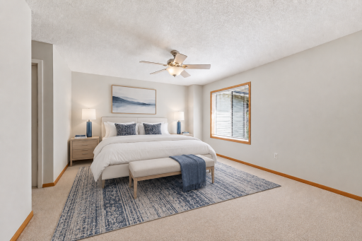 Upper-level primary bedroom suite with neutral finishes, natural light, and space for a full bedroom setup. (virtually staged to show potential layout).png