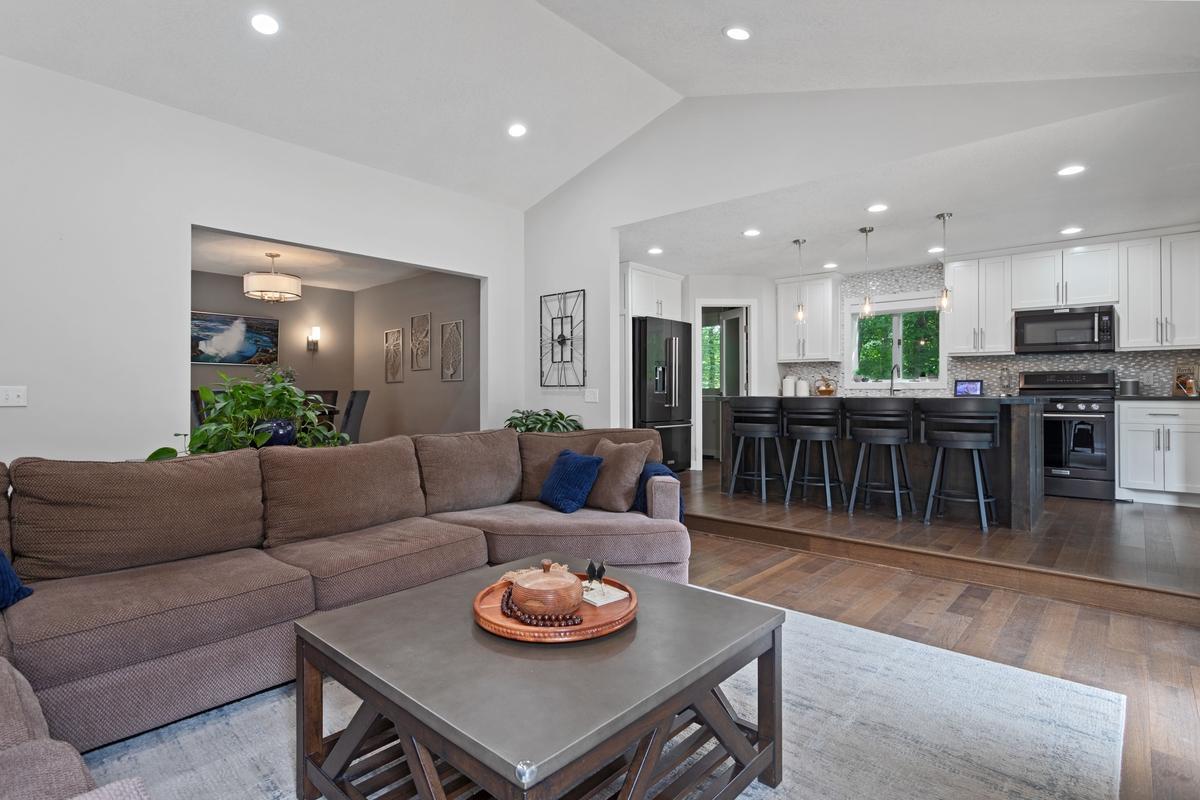 The living room is great for evening cozy TV and fireplace or entertaining as its open to the kitchen, dining and sunporch!!!
