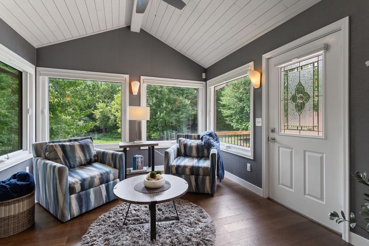 Sun room off the kitchen has a door out to the large deck overlooking the pool!