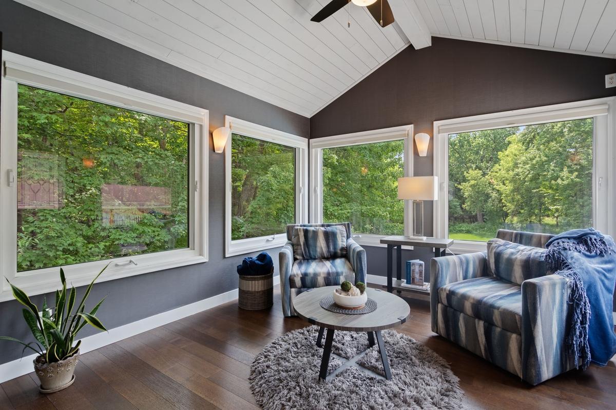 Beautiful engineered wood floors, the sun room has alot of beautiful windows over looking the private back yard!