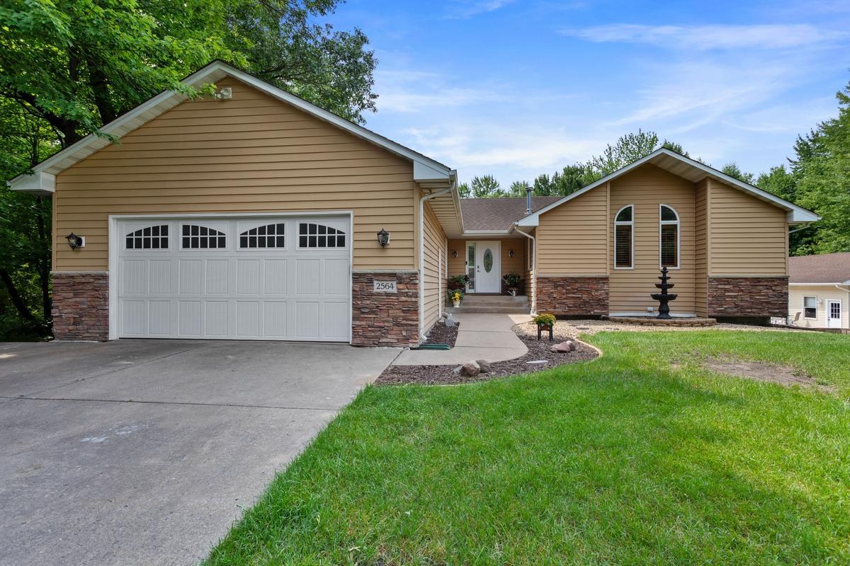 Welcome to your private, 3.6 acre heavily wooded sanctuary in Ham Lake! This exceptional 4 BR, 4BA,