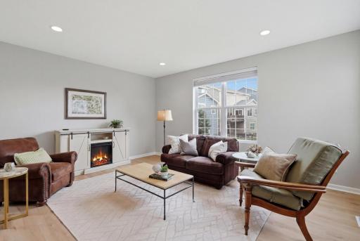 Abundant natural light highlights the fresh paint and modern flooring.