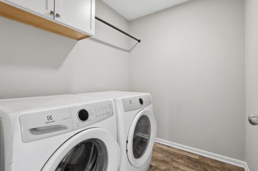 Convenient upper-level laundry room eliminates trips up and down stairs.