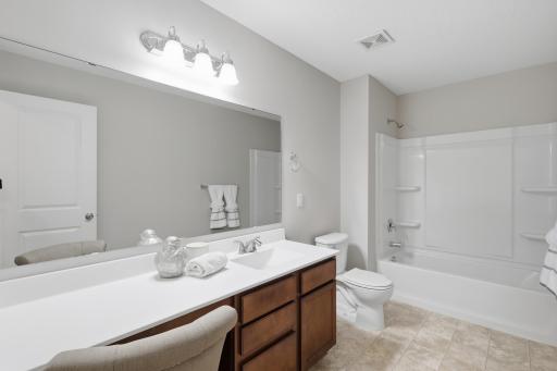Full upper-level guest bathroom serves family and guests with ease.