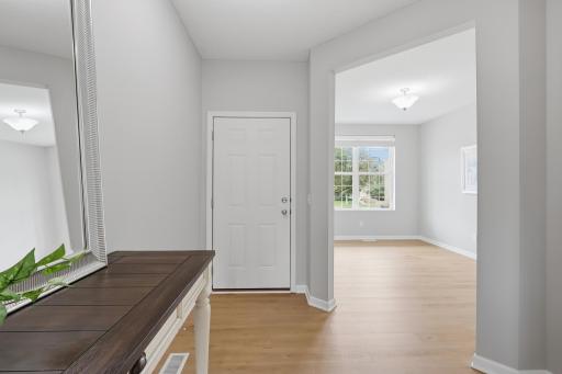 Bright and welcoming foyer with updated finishes throughout.