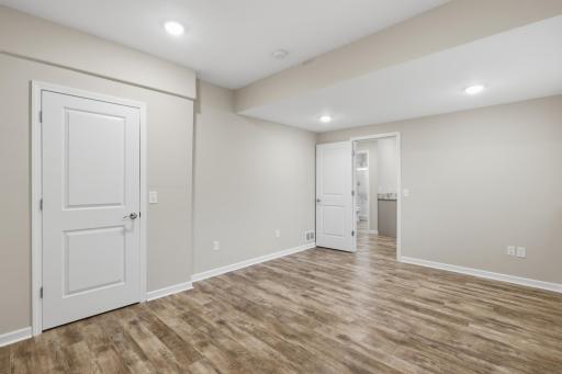 Lower-level bedroom is ideal for guests, teens, or a home office.