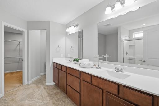 Luxurious owner's bath featuring double sink vanity, separate water closet and a oversized shower.