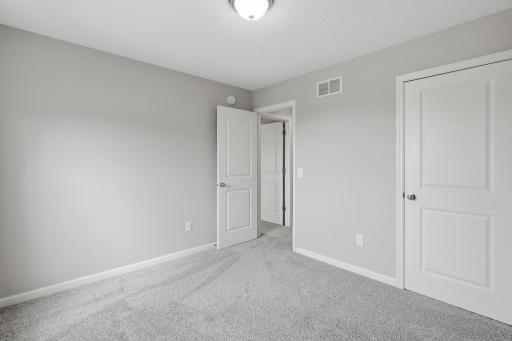 Thoughtfully designed upper level with three bedrooms on one floor.