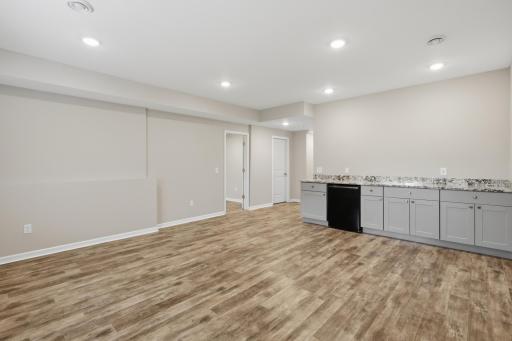 Custom built-in cabinetry adds character and functionality to the lower-level family room.