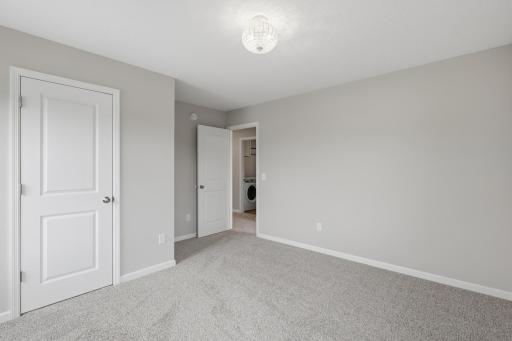 Bedrooms feature walk-in closets to provide exceptional storage and organization.