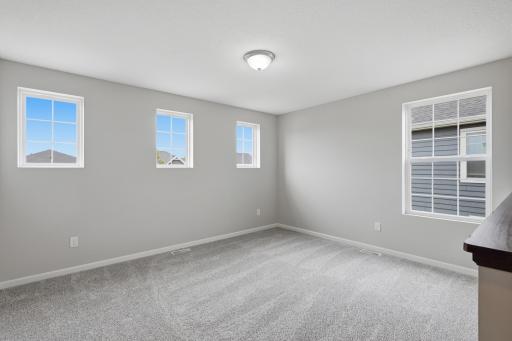 Upper-level loft is perfect for a reading nook, media room, or play area.