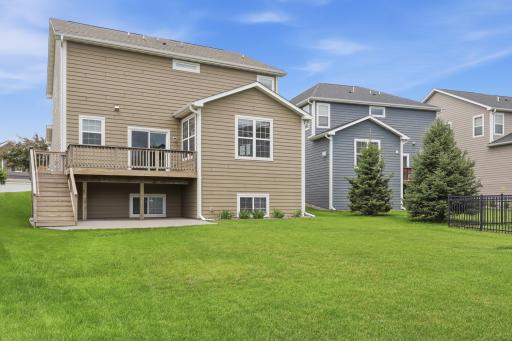 Backyard offers multiple outdoor living spaces for family and friends.
