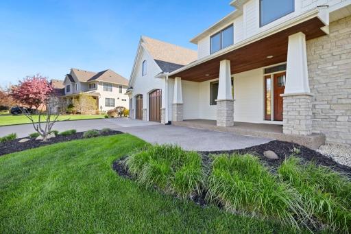The front porch is the first of many spaces in this home that invites you to slow down.