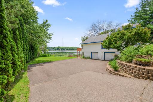 Parking galore! Flat lot from the retaining wall to the lake