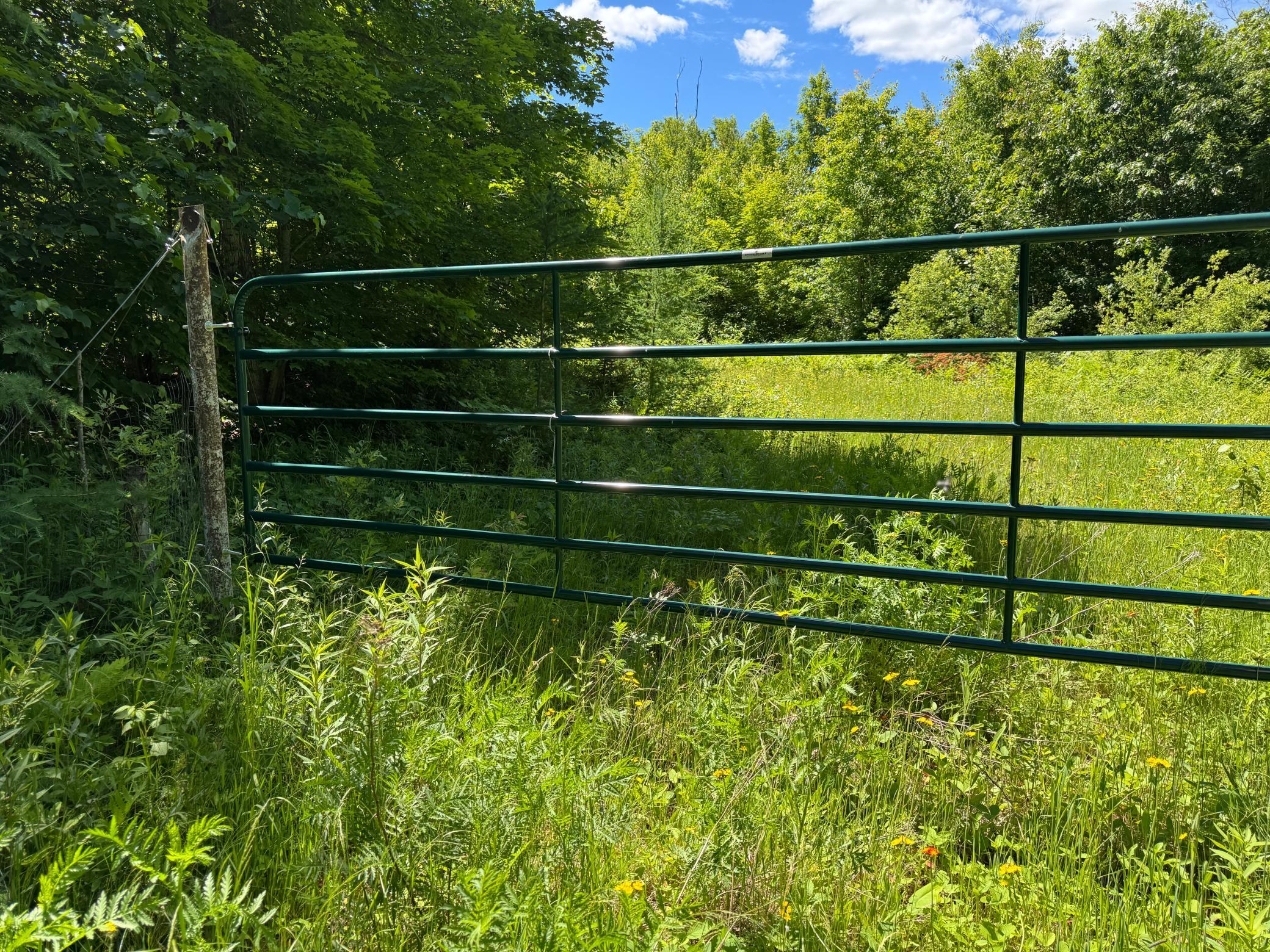 Building site has a locked gated entrance.