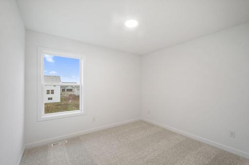 All the secondary bedrooms include a practical wardrobe closet and wall-to-wall carpeting for plush comfort.