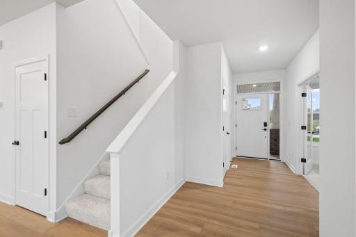 French doors section off the flex space from the main living areas, creating a layer of privacy
