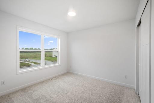 Three secondary bedrooms are situated upstairs, just down the hall from the ownerâs suite.