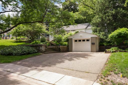 Double wide driveway and unique tuck-under garage is double-deep, providing excellent space for vehicle storage, hobbies, or additional storage